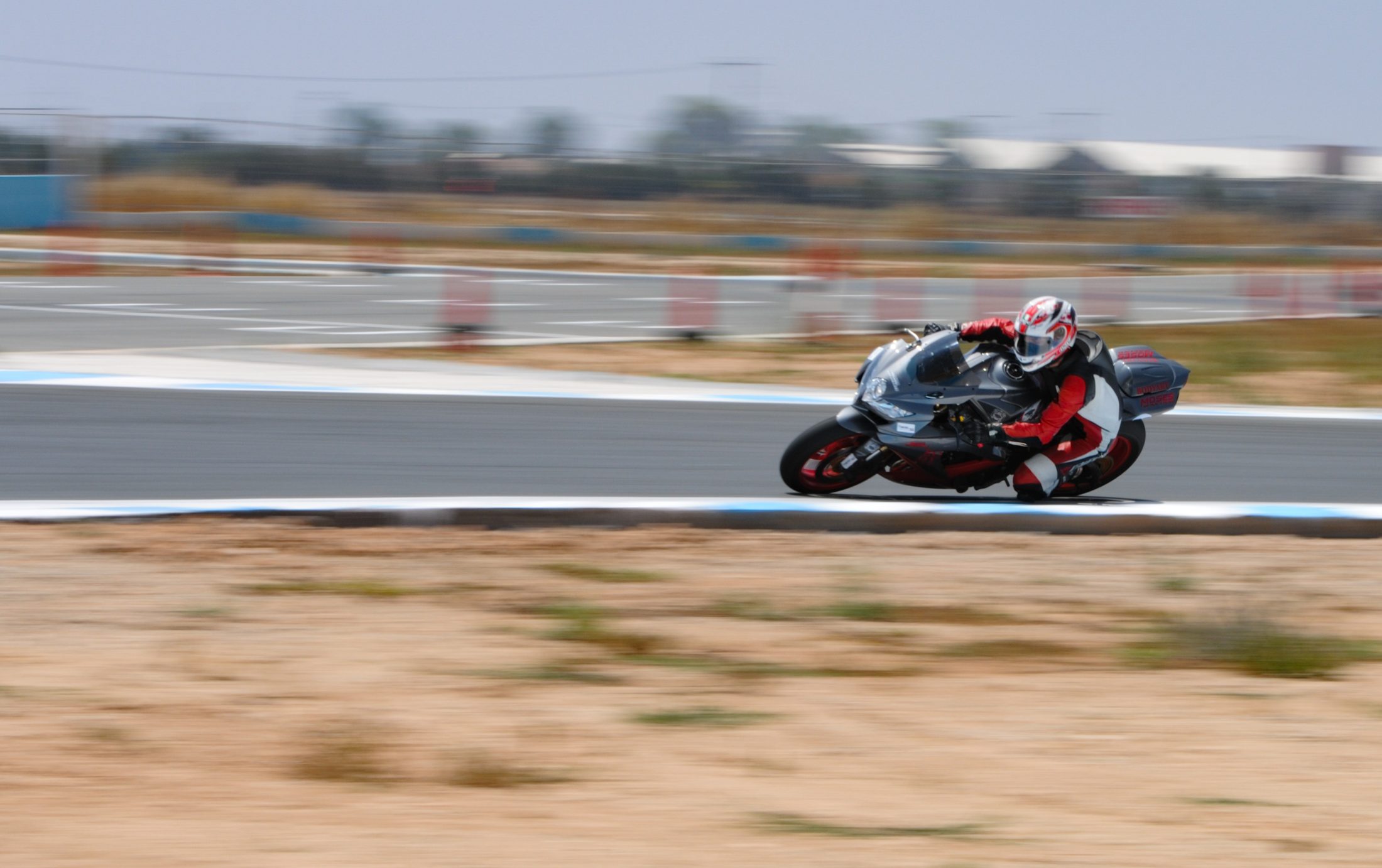 Superbike leaned into a corner on track